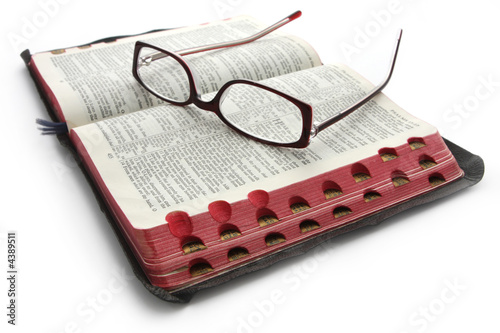 Photo: Open Bible with Glasses Open Bible with Glasses