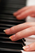 Two hands playing music on the piano Two hands playing music on the piano