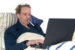 sick in bed with laptop. sick in bed with laptop.