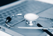 Stethoscope on a laptop keyboard - Blue Tone
