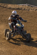 Teenager running his black quad bike