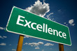 "Excellence" Road Sign with dramatic clouds and sky.