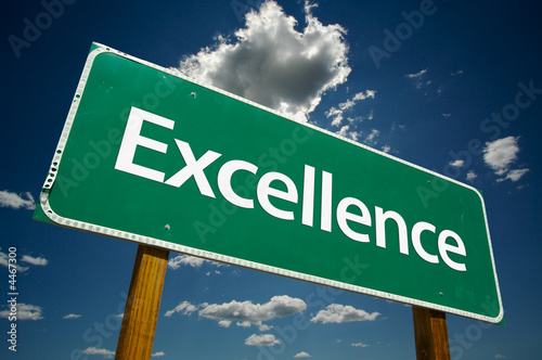 Photo: "Excellence" Road Sign with dramatic clouds and sky. "Excellence" Road Sign with dramatic clouds and sky.