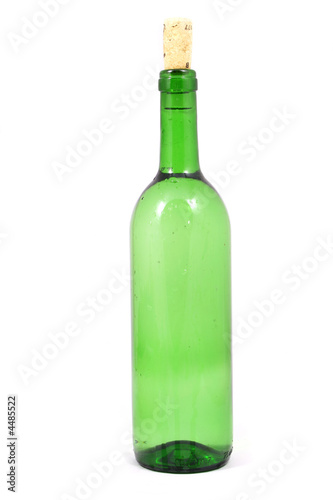 bottle and grapes isolated on white
