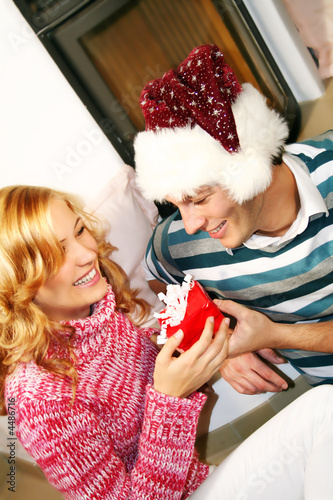 Photo: happy couple on christmas day happy couple on christmas day