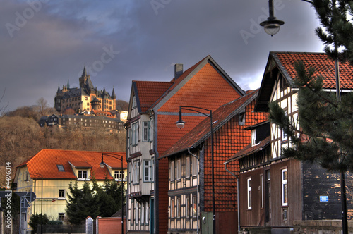 medieval castle on the hill and red roofed street in Wernigerode medieval castle on the hill and red roofed street in Wernigerode