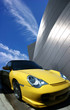 Luxury yelow car and mogern building