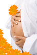 pregnant woman with flower holding her belly