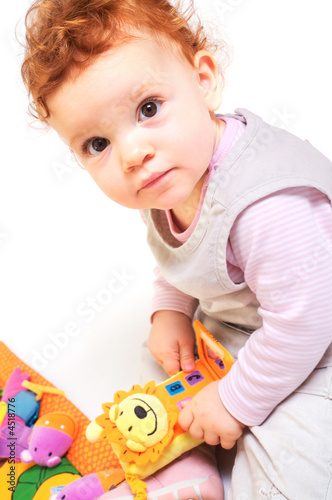 Photo: Redhead baby playing Redhead baby playing
