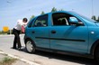Man pushing a car