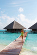 Water Villas and sexy Lady. Welcome to Paradise!