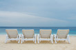Four chaise-longue on the beach of Ocean.