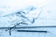 Business accessories on a background of diagrams.