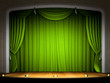 Empty stage with green curtain in expectation of perfomance