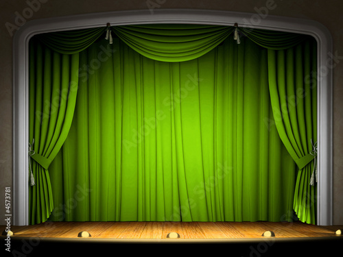 Empty stage with green curtain in expectation of perfomance