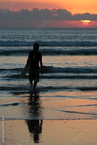 Photo: Surfer at sunset Surfer at sunset