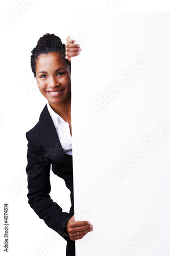 Woman standing beside board Woman standing beside board