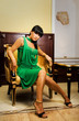 Gorgeous brunette sitting on a golden chair