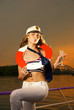 Attractive girl on a yacht with a life buoy on her neck Attractive girl on a yacht with a life buoy on her neck