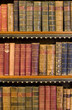 Lots of old books on a bookshelf in library. Lots of old books on a bookshelf in library.