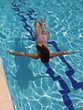 girl diving in pool