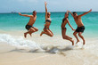 People jumping in the ocean