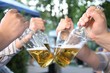 hands with bottles with the beer hands with bottles with the beer