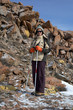 Yong woman travels in winter mountain