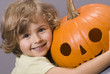 beautiful four years old with pumpkin