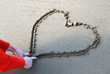Drawing a heart in the sand