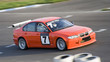 Red sportcar speeding to finish