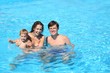 family in the swimming pool