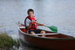 Foto: Boy paddling a canoe Boy paddling a canoe
