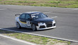 Silver-deep-blue sportcar in a race