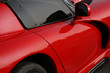 side of red exotic car