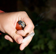 hand with cigarette and lighter