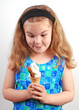 Photo: Studio photograph of child delighted with her ice cream Studio photograph of child delighted with her ice cream