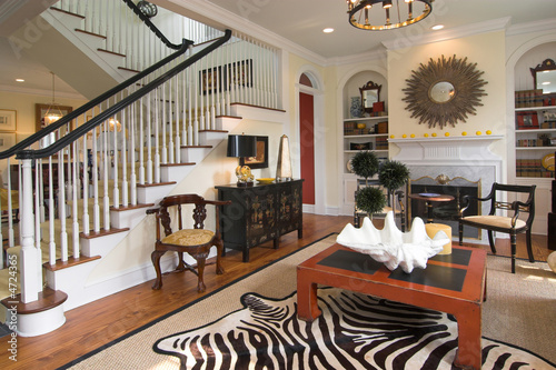 Photo: well decorated living area and staircase well decorated living area and staircase