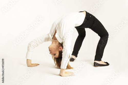 Photo: BUSINESSWOMAN STRETCHING BACKWARDS BUSINESSWOMAN STRETCHING BACKWARDS