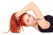Red-headed girl laying with her hands on the nape Red-headed girl laying with her hands on the nape