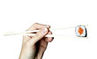 Isolated sushi in chopsticks