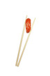 Sushi with chopsticks shot on white