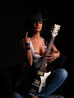 Photo: Beautiful latino rock chick with an electric guitar Beautiful latino rock chick with an electric guitar
