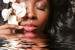 Beautiful black woman with orchid