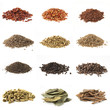 piles of various kinds of spices on white piles of various kinds of spices on white