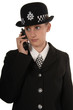 UK female police officer using her radio UK female police officer using her radio