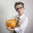 Boy hugging piggy bank
