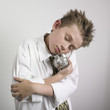 Boy cradling piggy bank