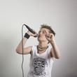 Boy singing into microphone