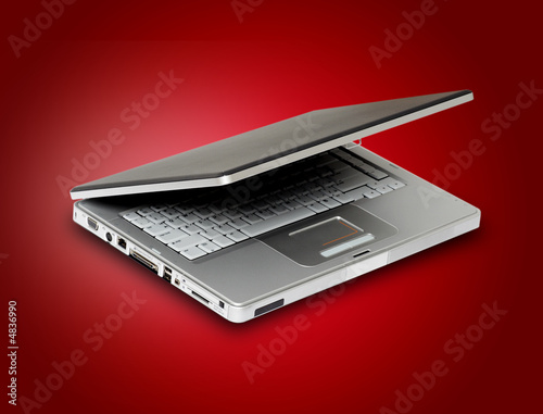 Laptop in red background Laptop in red background
